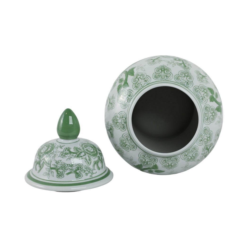 Green and white ceramic jar with lid on a white background