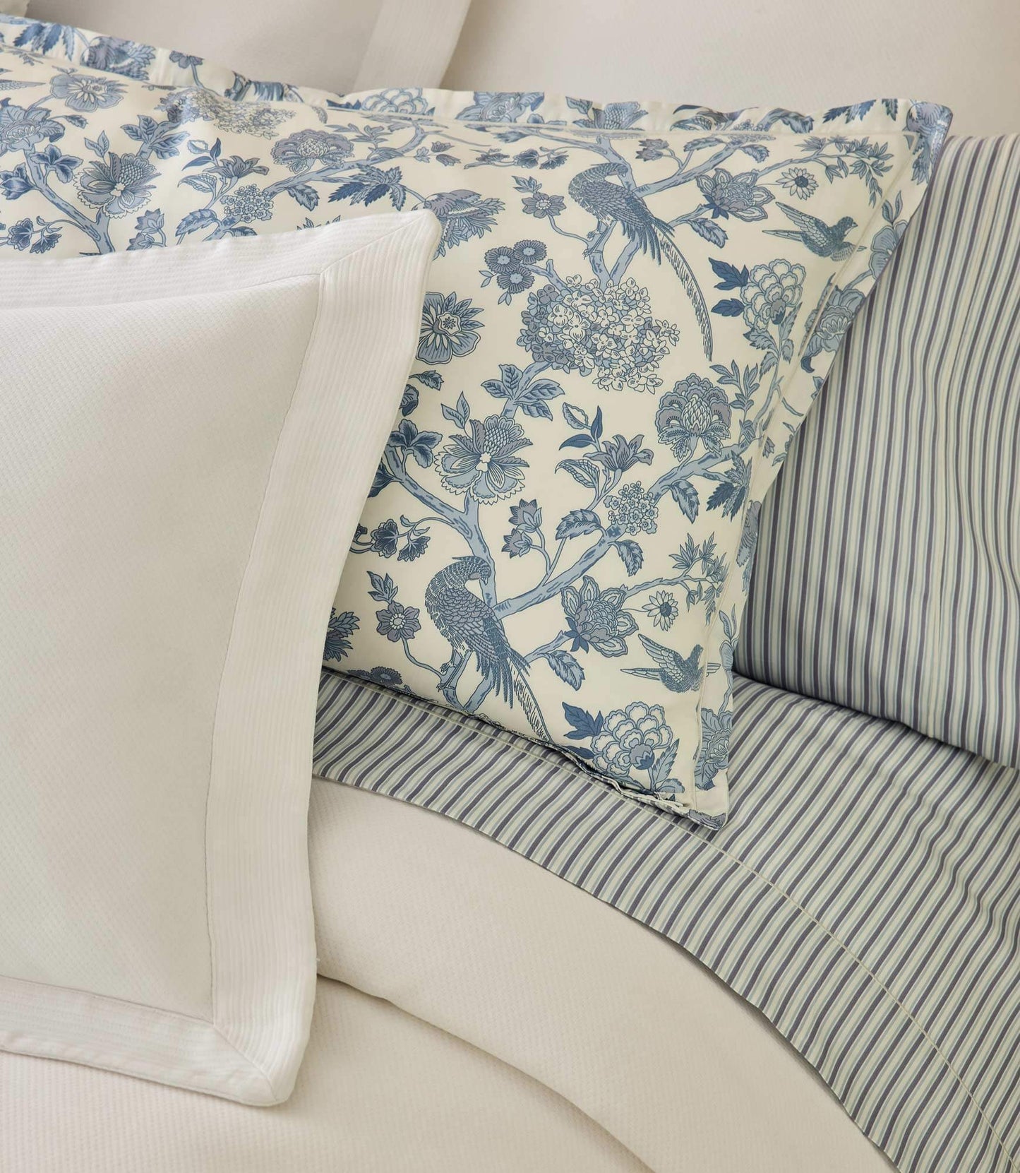 The Windsor sheet set with blue floral pillow sham and blue striped sheets