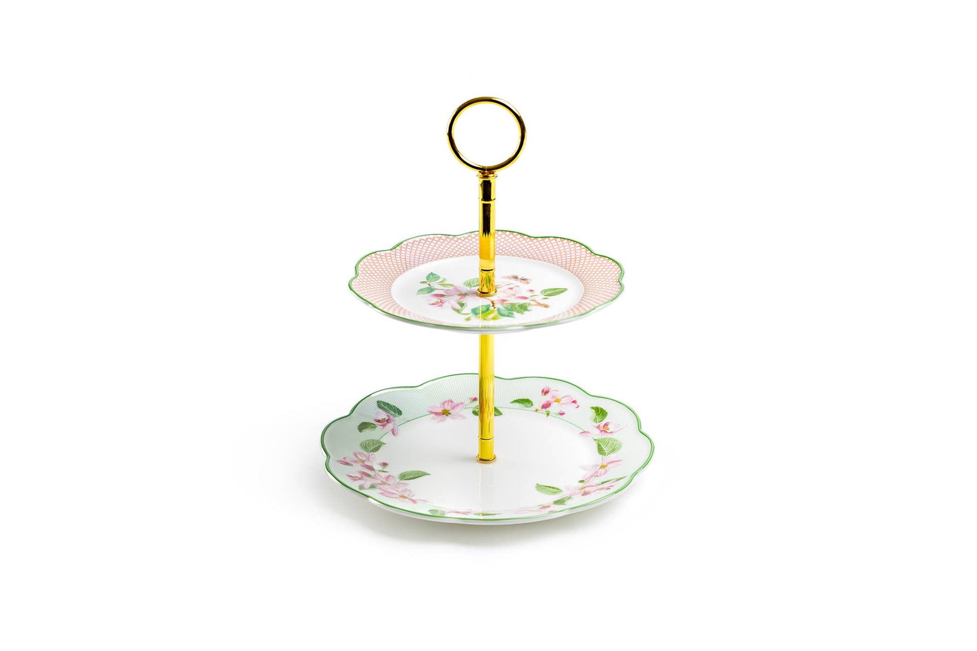 Two-tiered ceramic cake stand with floral design on a white background