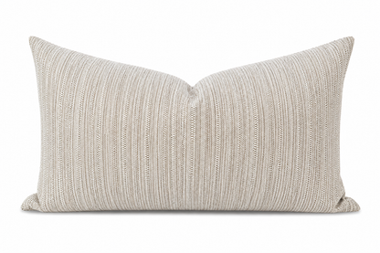 Textured beige pillow on a white background