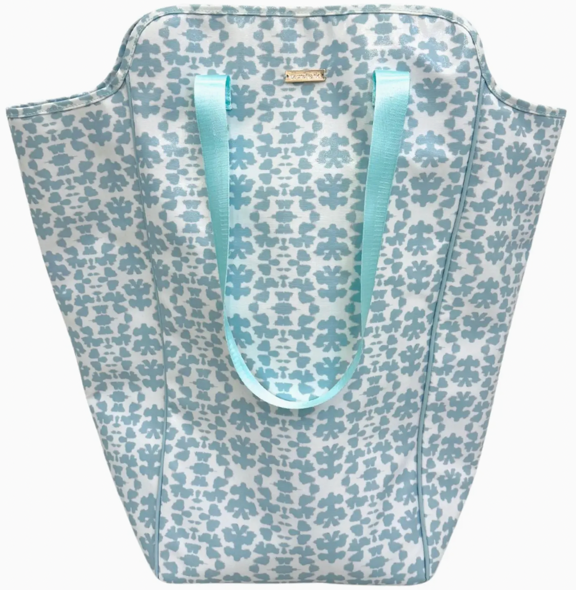 Floral-patterned tote bag with light blue handles on a white background