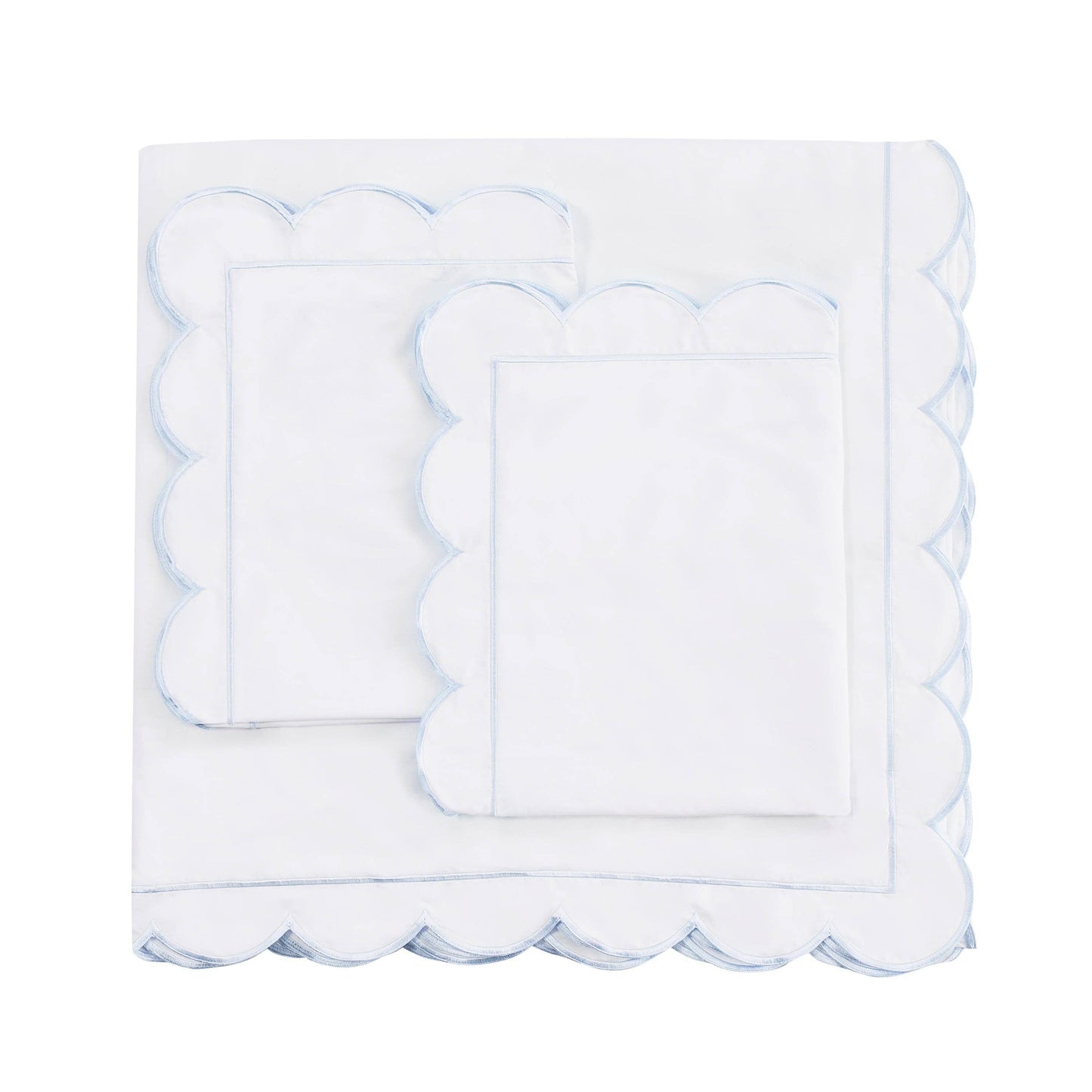 White scalloped edge napkin on a white background