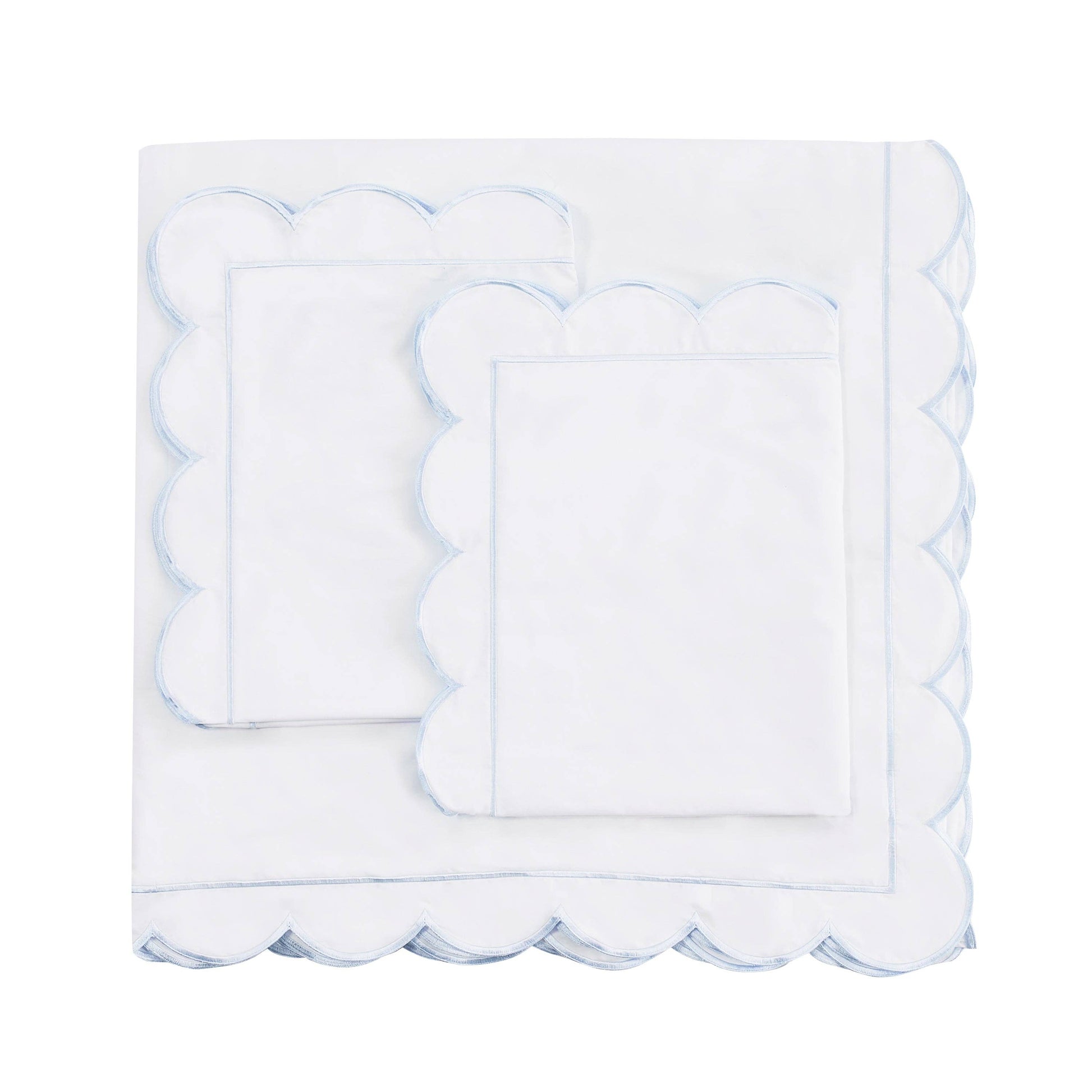 White scalloped edge napkin on a white background