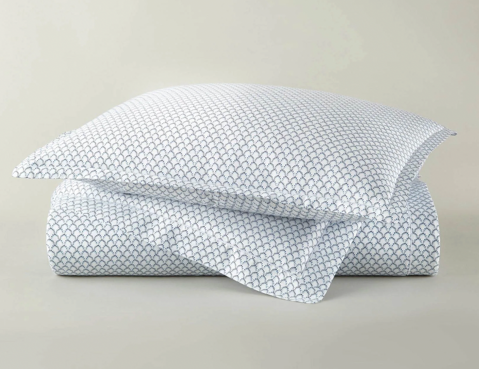 Demi navy duvet cover set with coordinating shams — folded and styled flat