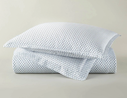 Demi navy duvet cover set with coordinating shams — folded and styled flat