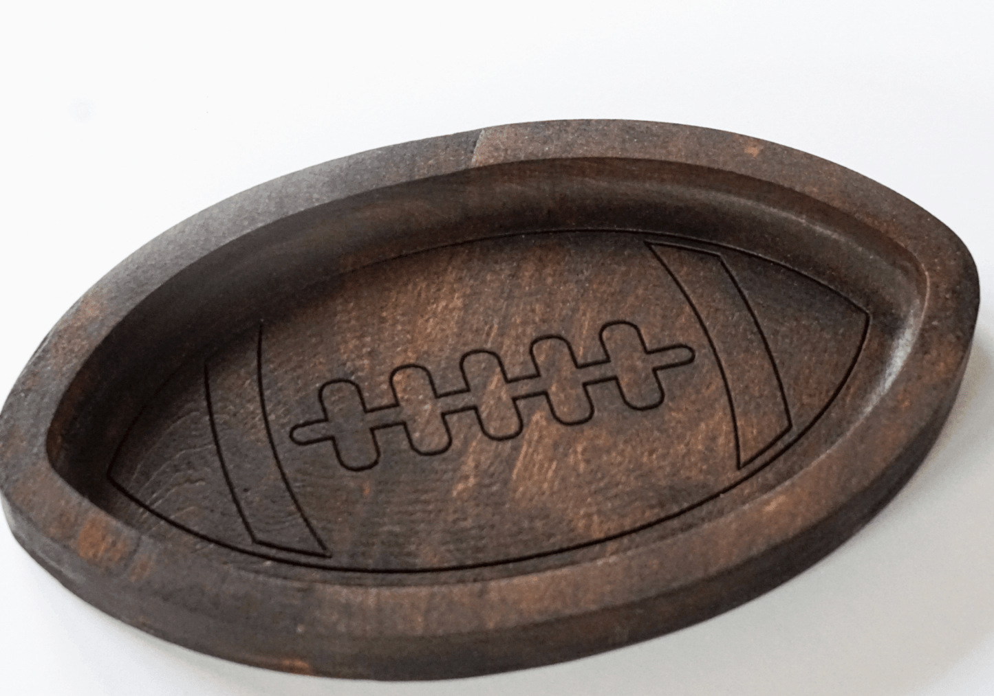 Wooden football catch all tray on a white background