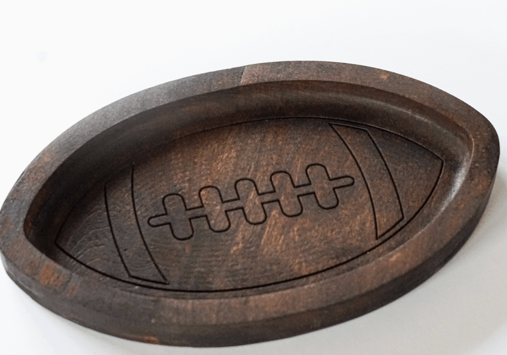 Wooden football catch all tray on a white background