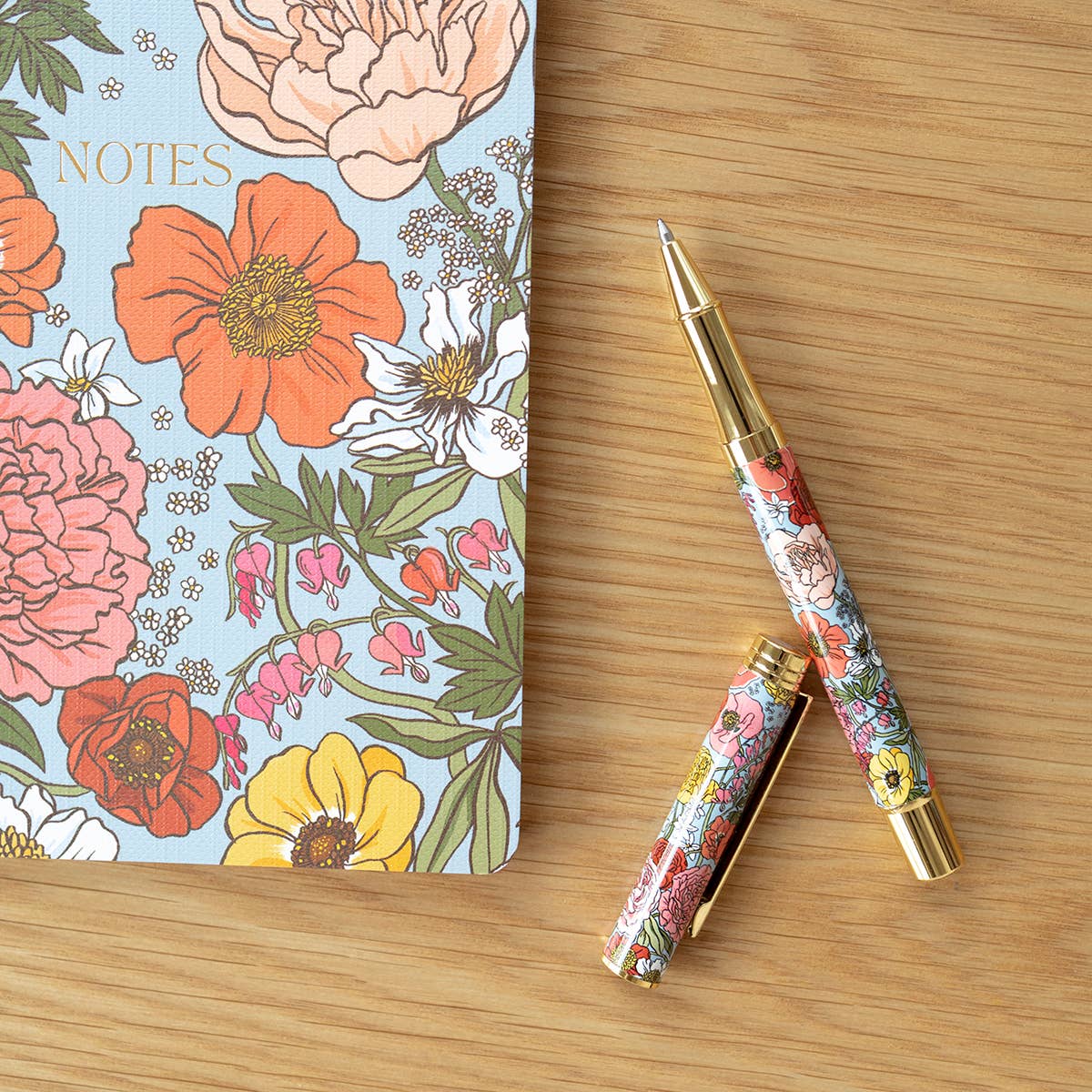 GARDEN FLORA | ROLLERBALL PEN -    Product image highlighting color, material, and overall design