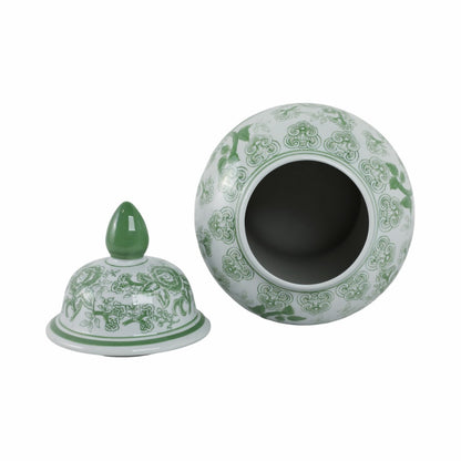 Green and white ceramic jar with lid on a white background