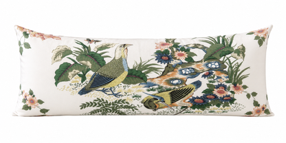 Decorative pillow with peacock and floral pattern on a white background