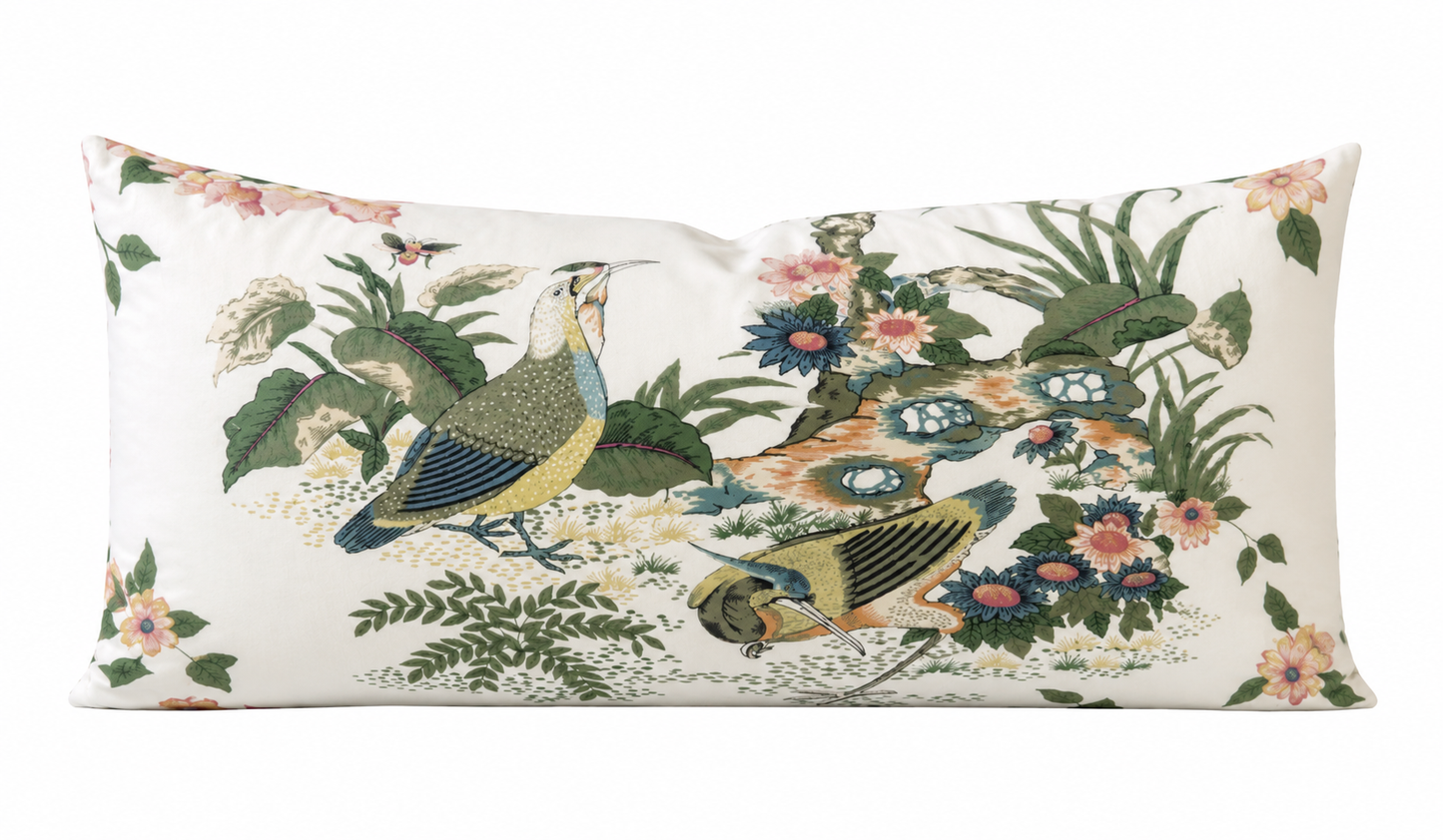 Decorative pillow with bird and floral pattern on a white background