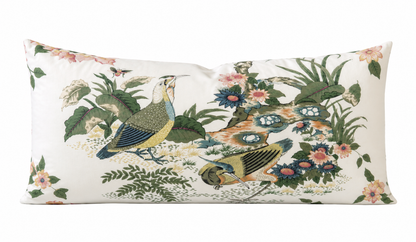 Decorative pillow with bird and floral pattern on a white background