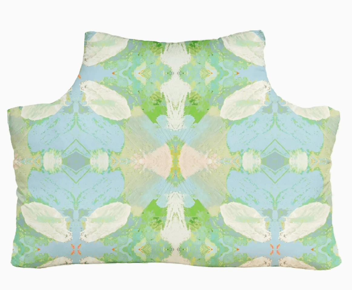 Decorative headboard pillow by Laura Park with a butterfly pattern on a white background