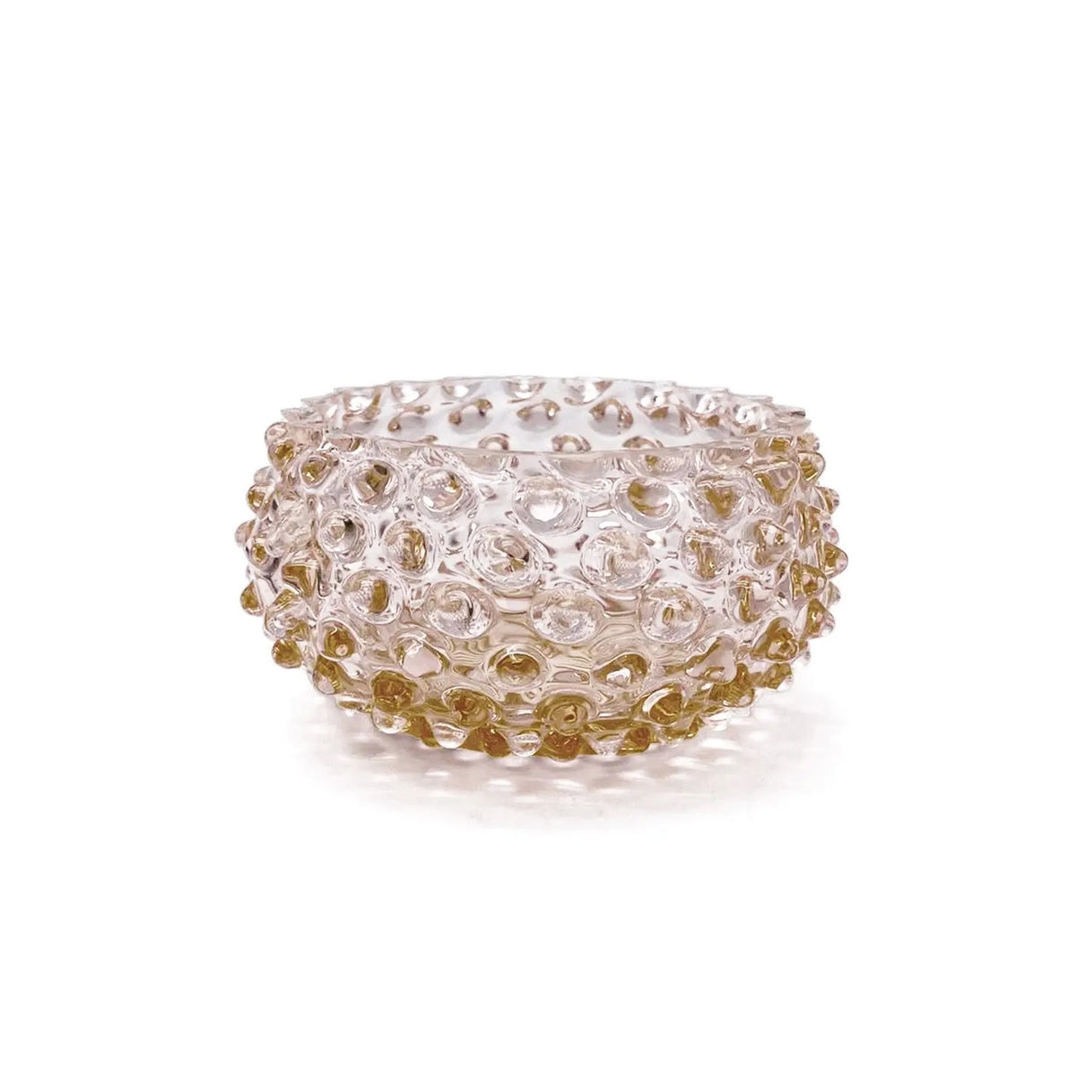 Decorative glass bowl with gold and clear design on a white background