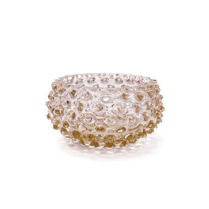 Decorative glass bowl with gold and clear design on a white background