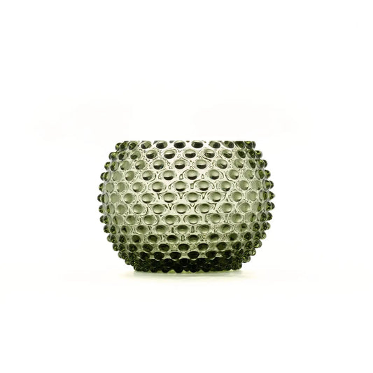 A small textured glass candle holder with a bubble or honeycomb pattern, shown on a plain white background.