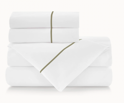 Folded white bed sheets with a green line on a white background