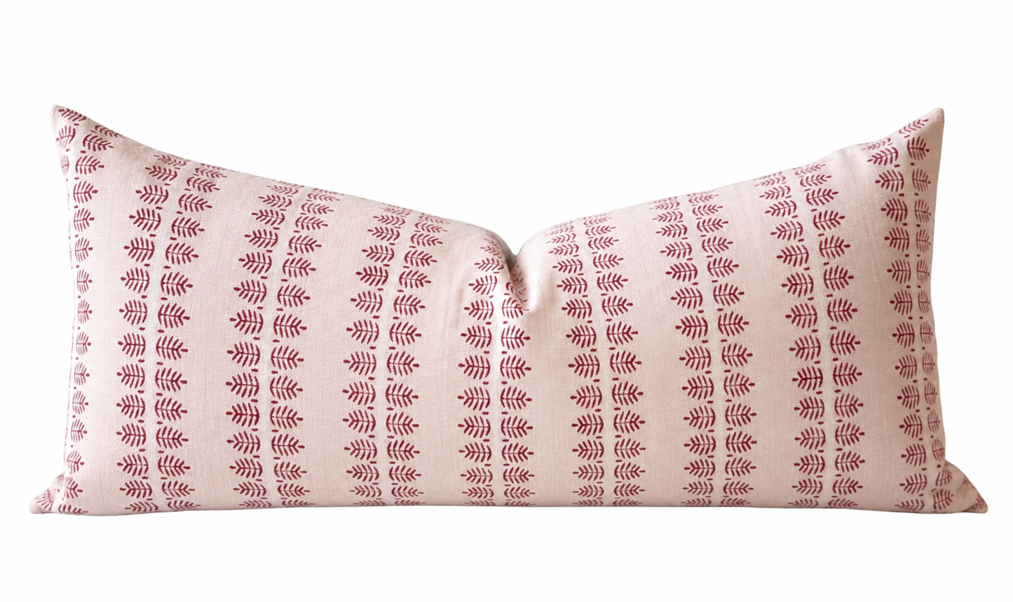 Pink patterned pillow on a white background