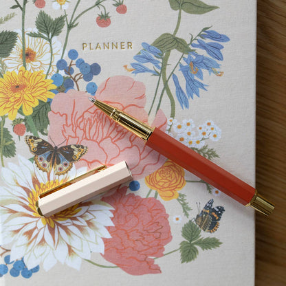 ROSE TERRACOTTA | ROLLERBALL PEN -   Product image highlighting color, material, and overall design