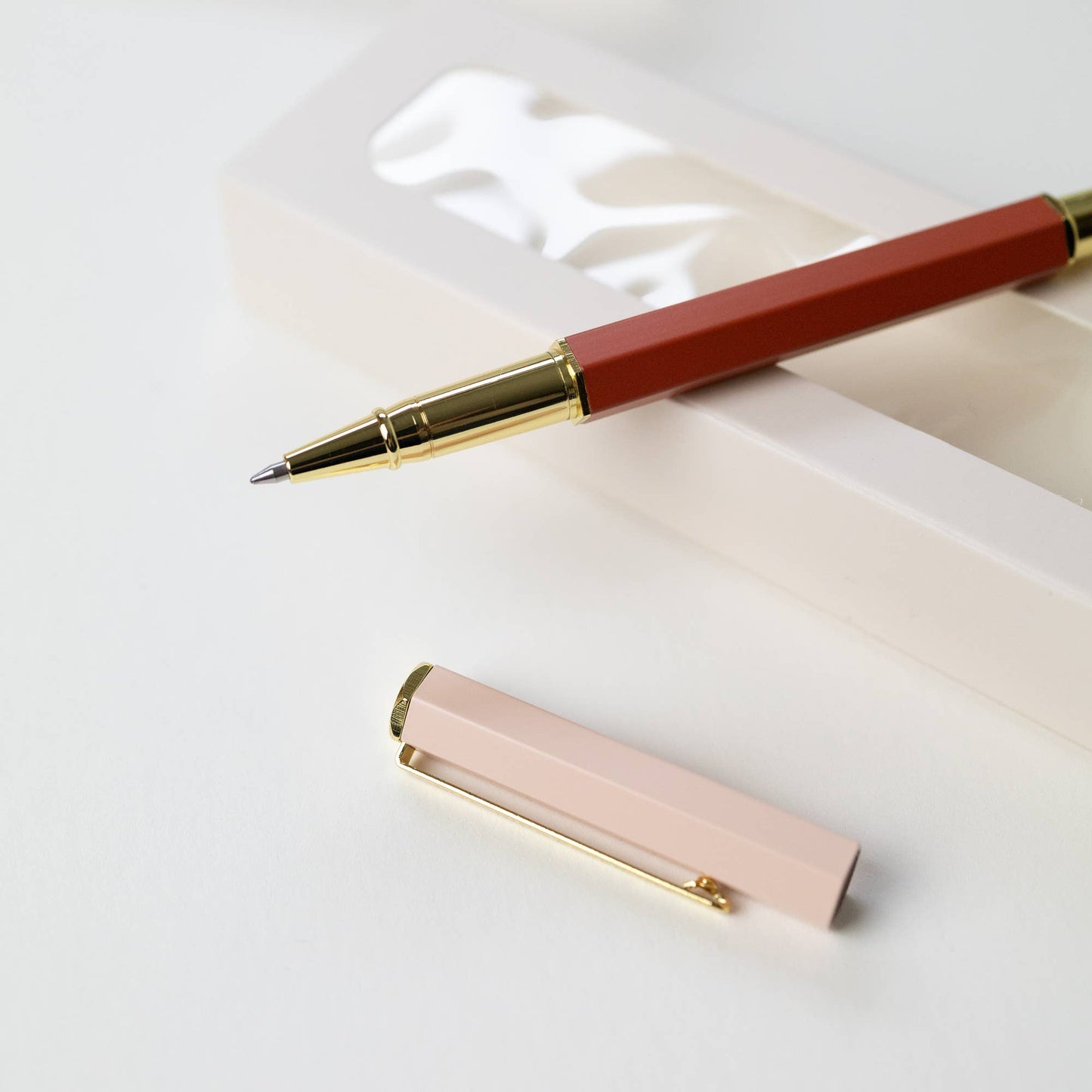 ROSE TERRACOTTA | ROLLERBALL PEN -   Product image highlighting color, material, and overall design