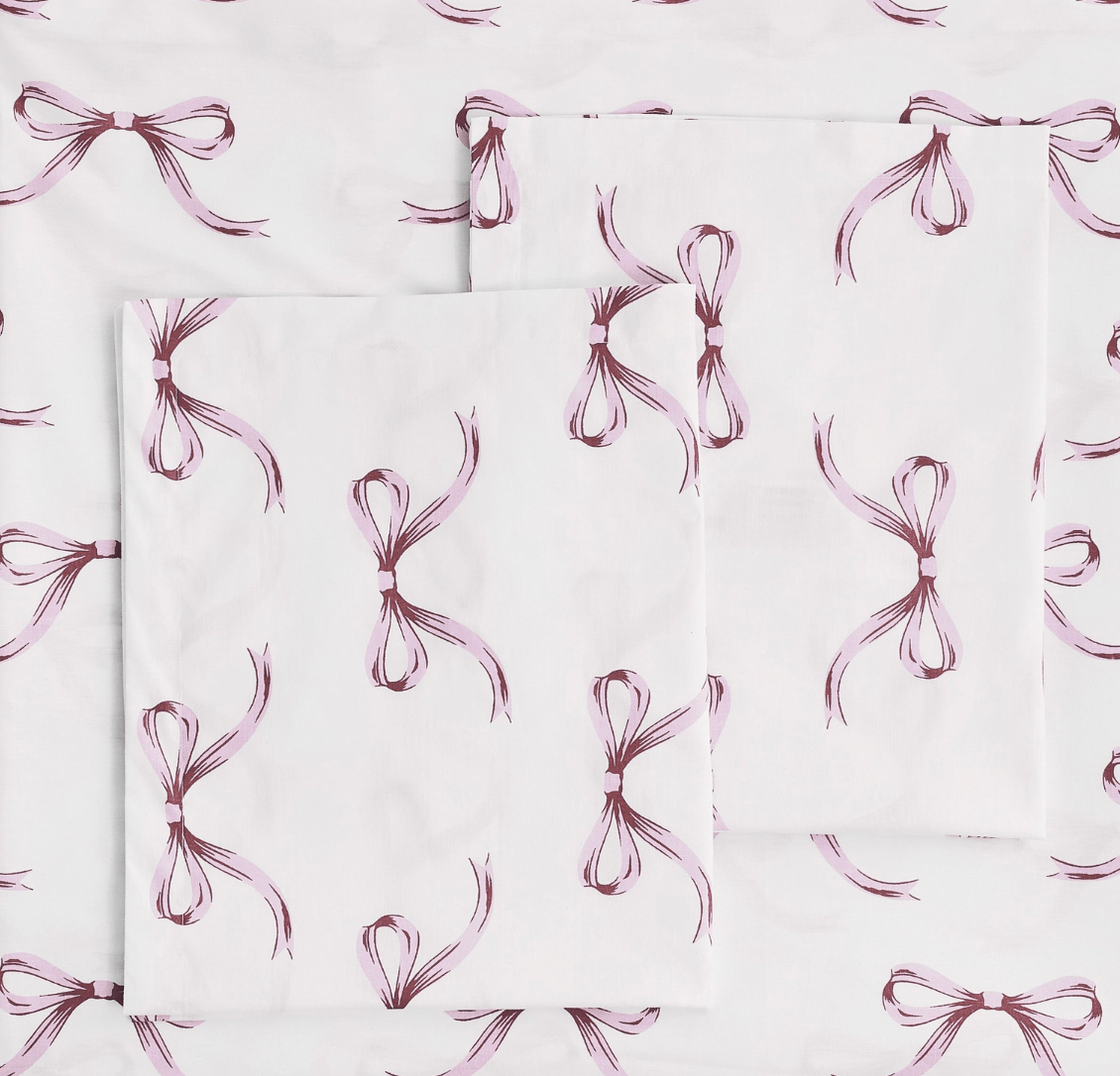 Pattern of pink bows on a white background