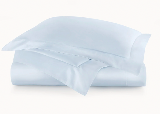 Light blue satin pillowcase on a white background