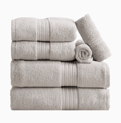 Beige monogrammed bath towel set styled folded and rolled, part of the monogrammed dorm bath bundle
