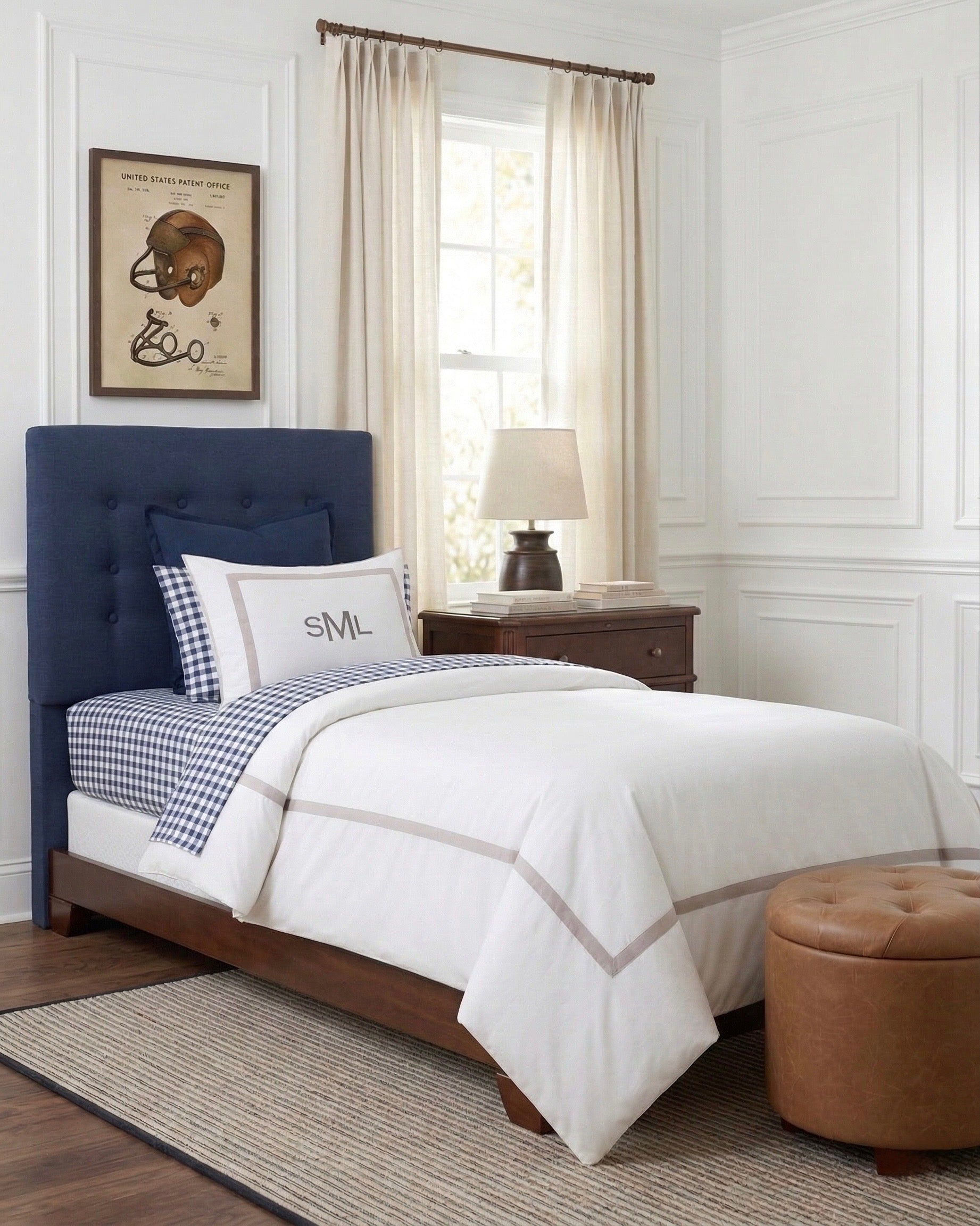 Bedroom with a blue upholstered headboard and white bedding