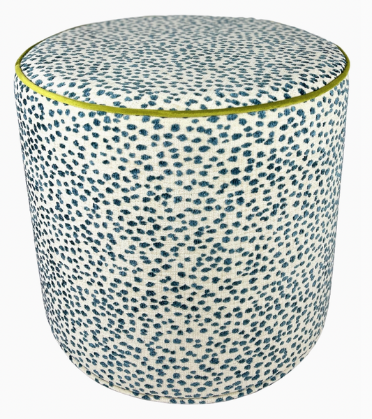 Round ottoman with blue and white pattern on a white background