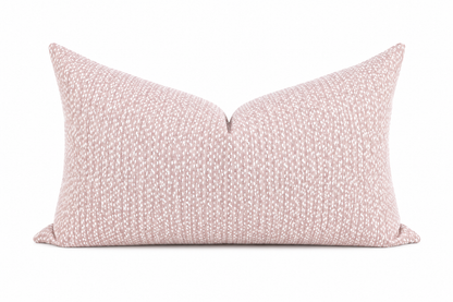 Pink textured pillow on a white background