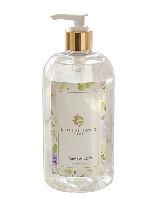 Vetiver & Lily Hand Soap clear bottle with pump and floral label on a white background