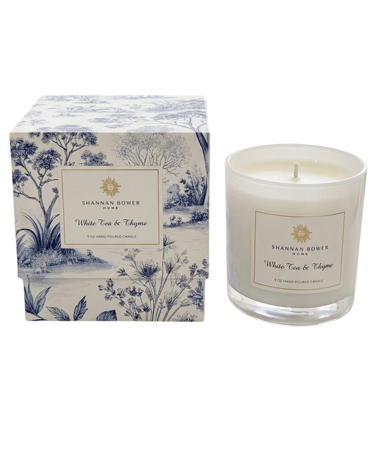 White Tea & Thyme Candle with decorative box featuring floral design on a white background