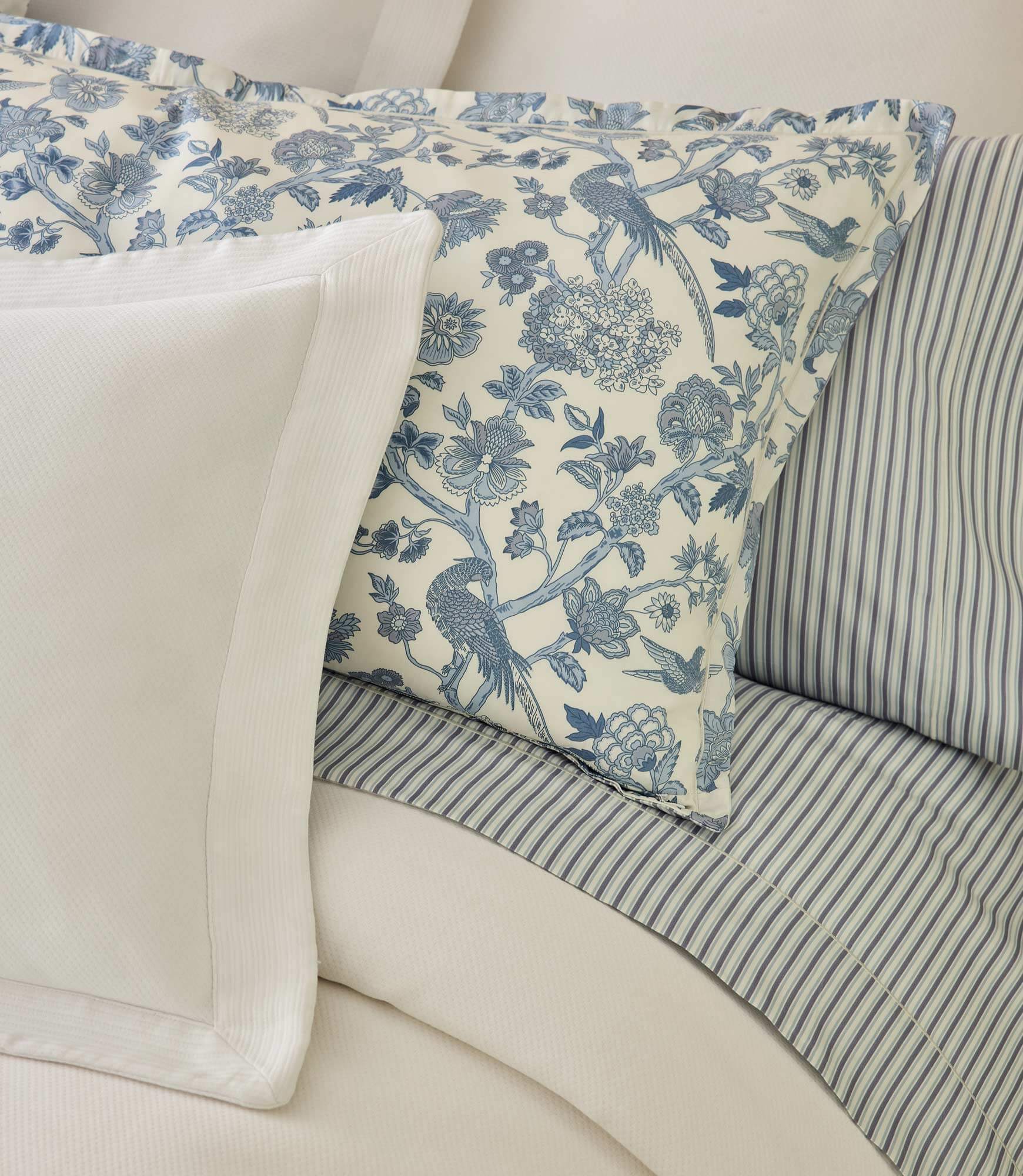 The Windsor sheet set with blue floral pillow sham and blue striped sheets