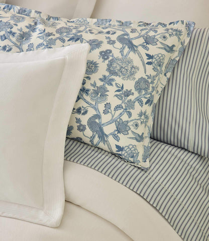 The Windsor sheet set with blue floral pillow sham and blue striped sheets