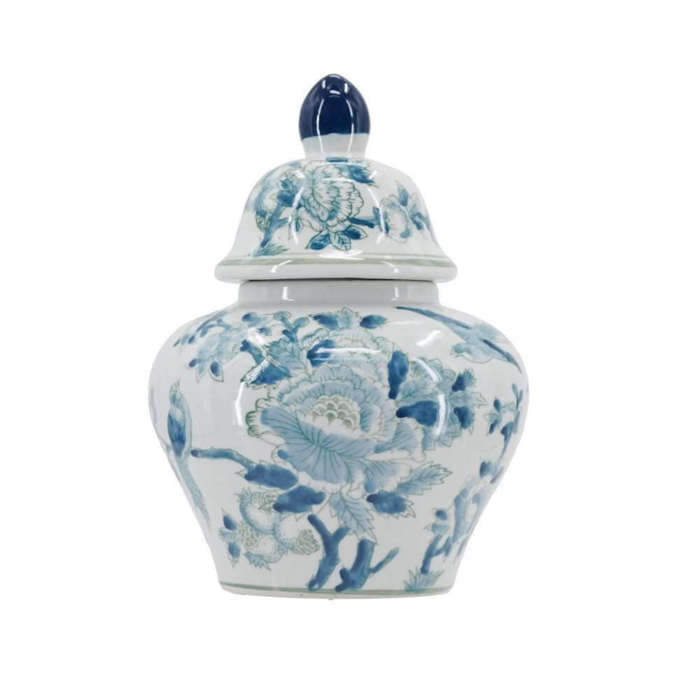 A white ceramic ginger jar with a matching lid, decorated with blue floral patterns and featuring a dark blue finial on top, set against a plain white background.