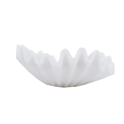 A white, semi-translucent pleated filter disc, commonly used for coffee brewing, shown against a plain white background.