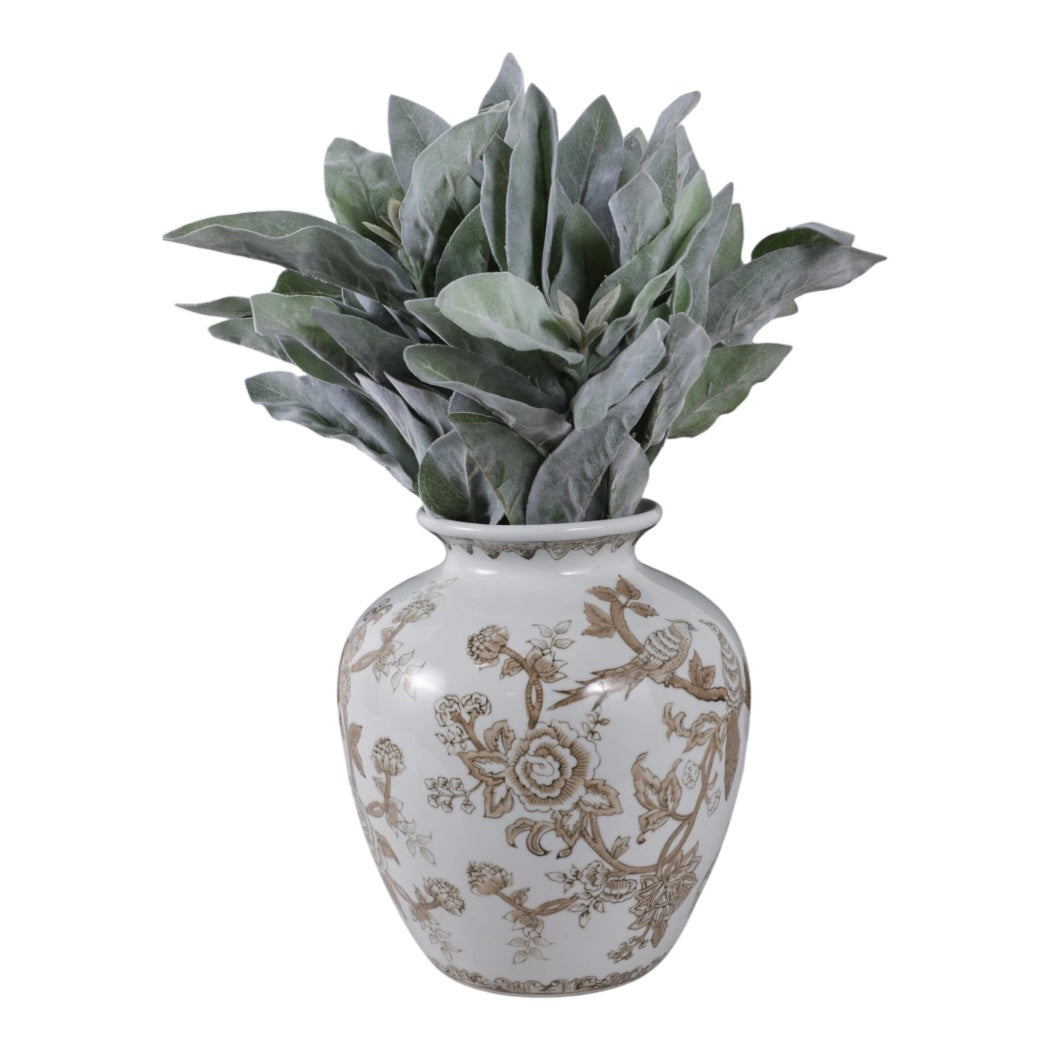 Decorative vase with floral patterns containing a green plant on a white background