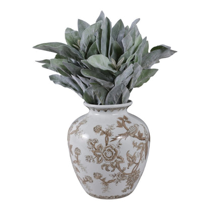 Decorative vase with floral patterns containing a green plant on a white background